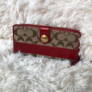 Coach signature zip wallet.